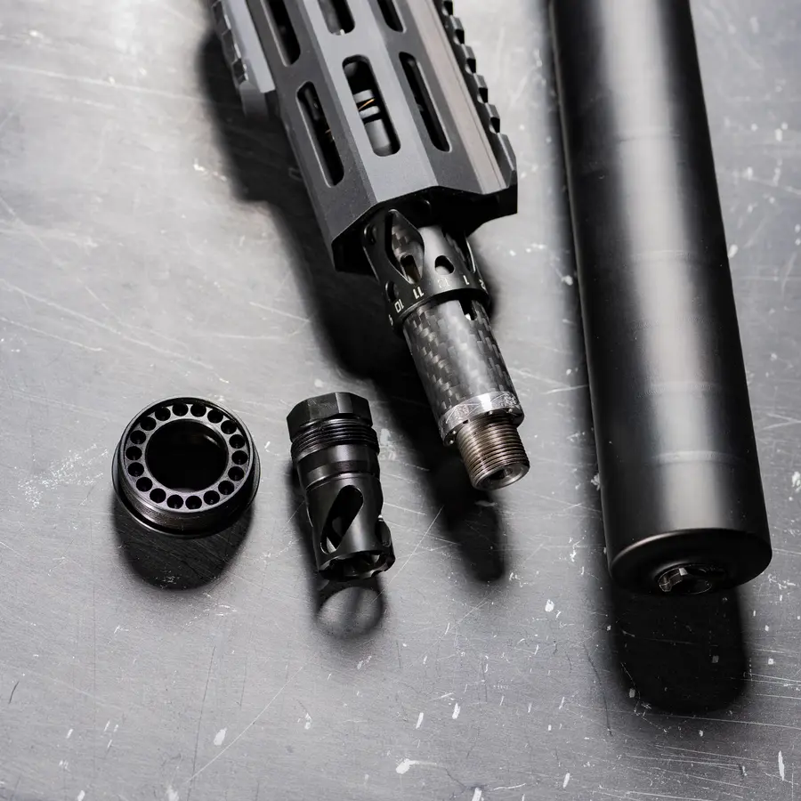 Plan B components arranged beside a firearm platform